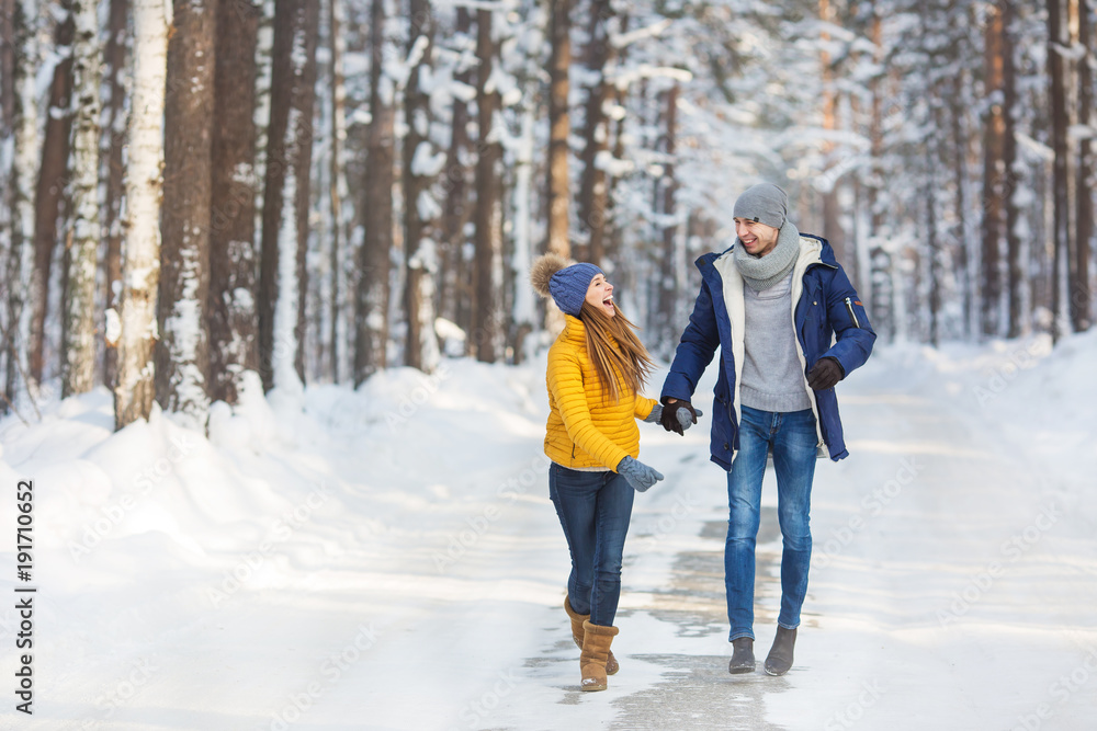 Young couple in a bright clothes walk and laught in a forest Young couple in a bright clothes walk and laught in a forest