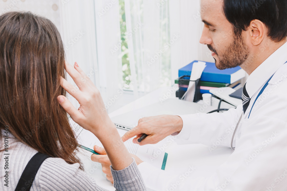 Fototapeta premium Doctor and woman patient consulting on doctors table in hospital.healthcare and medicine