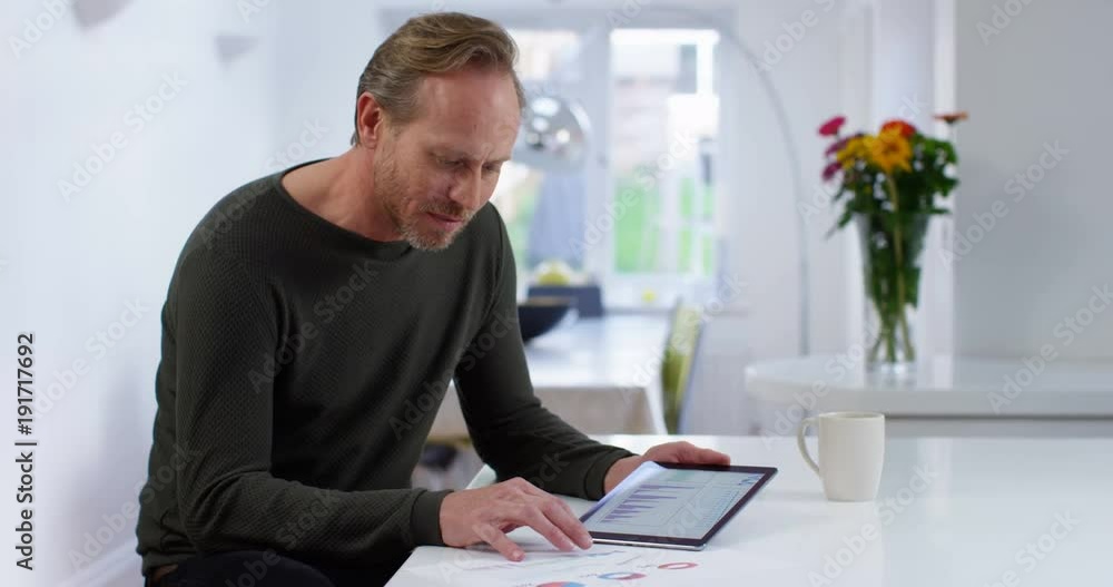 4K Business entrepreneur working from home & checking the company figures on tablet computer 4K Business entrepreneur working from home & checking the company figures on tablet computer