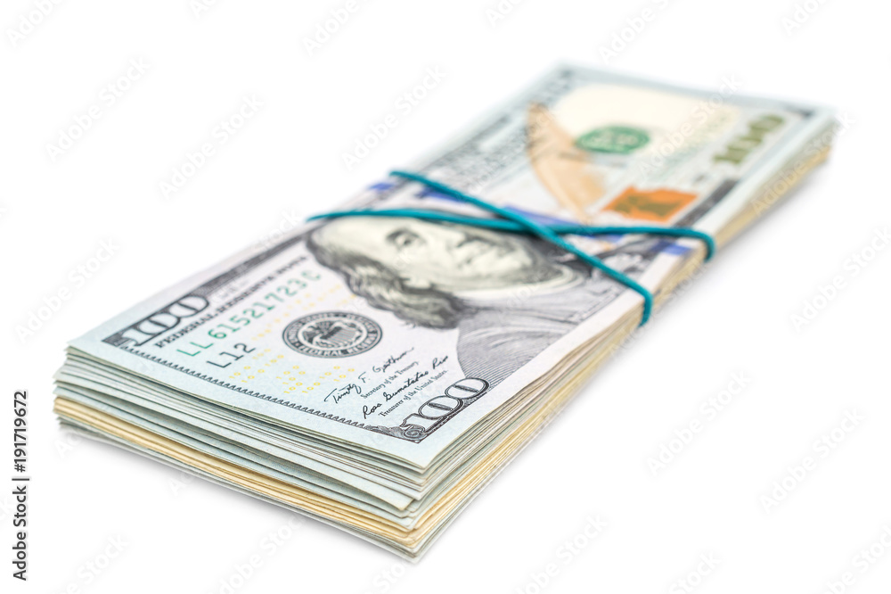 Stack of dollar bills held together by rubber band on white background. Stack of dollar bills held together by rubber band on white background.