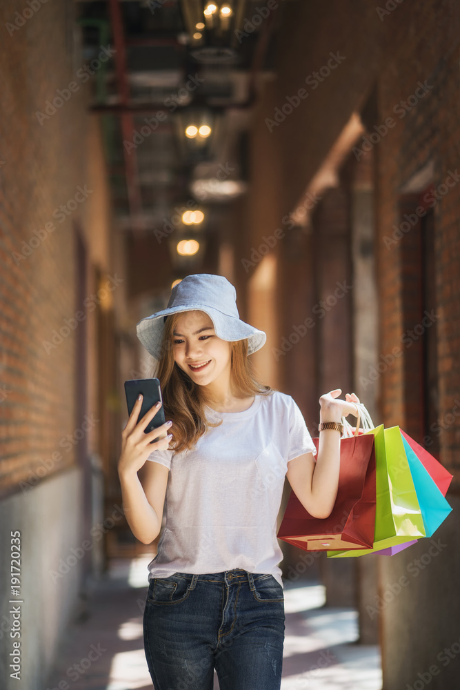 Young woman with shopping bags walking and shopping in the shop, Woman lifestyle concept Young woman with shopping bags walking and shopping in the shop, Woman lifestyle concept