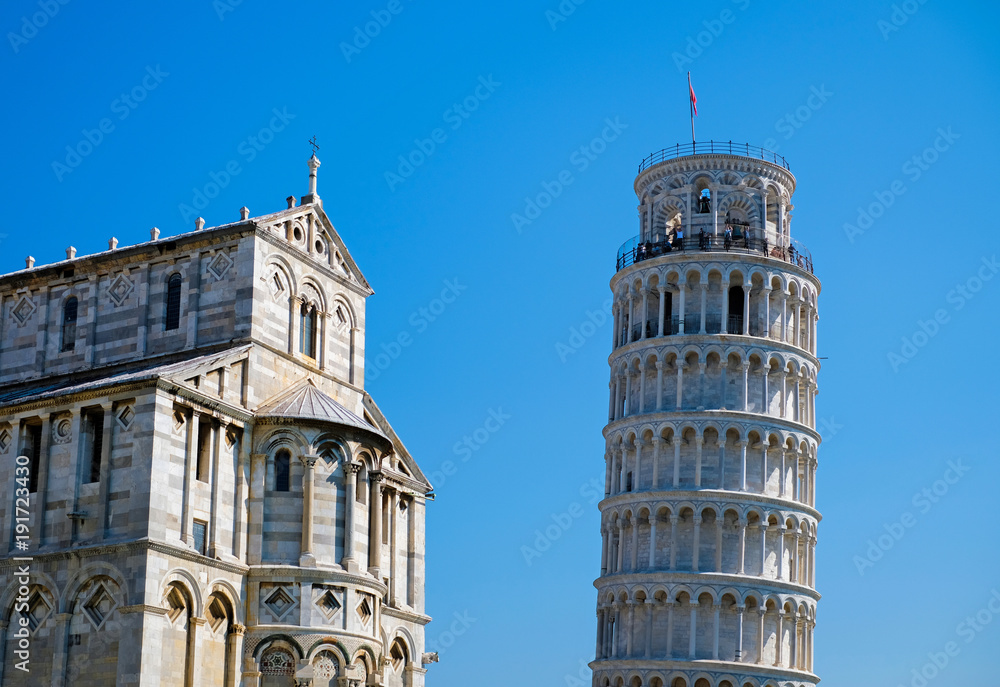 Pisa Cathedral (Duomo di Pisa) with the Leaning Tower of Pisa on Piazza dei Miracoli in Pisa, Italy.
