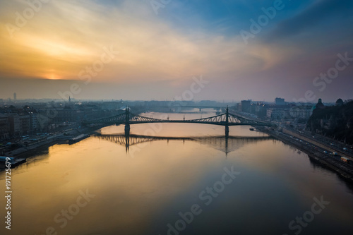 Budapest, Hungary - Aerial panoramic skyline view of Liberty Bridge over River Danube at sunrise with beautiful sky and clouds