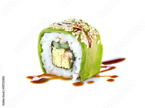 Sushi roll over white background. Sushi roll with eel, tofu, vegetables and avocado closeup. Japanese food 