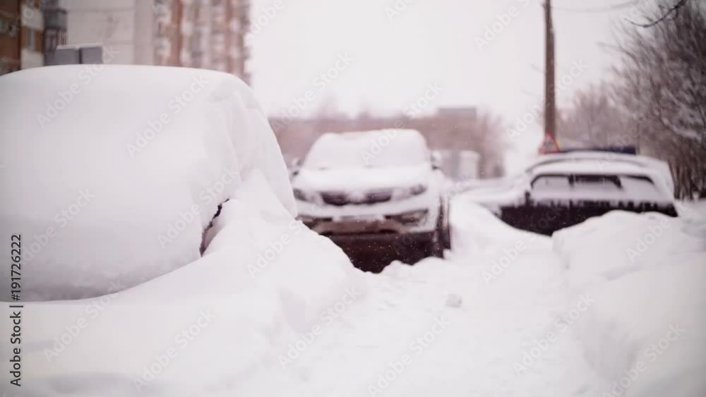 Cars covered with snow in a residential area of Moscow. Cars covered with snow in a residential area of Moscow.