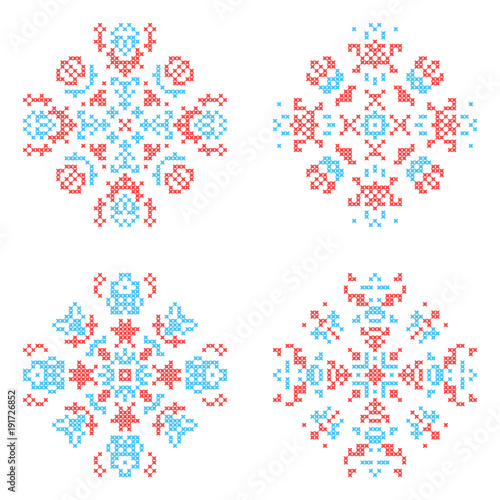 Embroidered elements for design. Ornate cross stitching flowers.