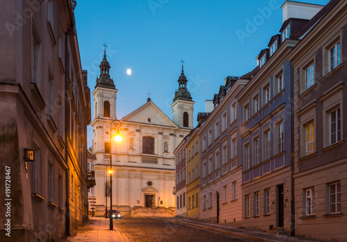 Pauline church of St. Spirit and Mostowa street at night on the old town in Warsaw, Poland