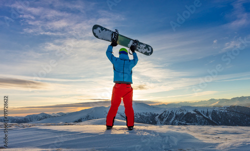 Snowboarder on the top of mountain, Alpine scenery