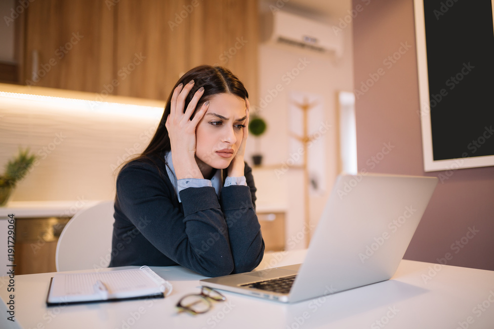Frustrated worried young woman looks at laptop upset by bad news, teenager feels shocked afraid reading negative bullying message, stressed girl troubled with problem online or email notification. Frustrated worried young woman looks at laptop upset by bad news, teenager feels shocked afraid reading negative bullying message, stressed girl troubled with problem online or email notification.