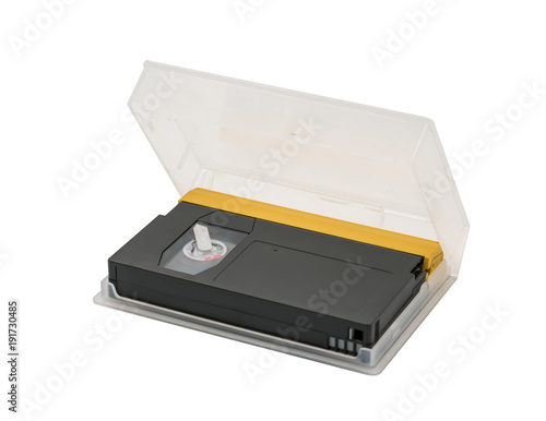 Digital video tape in black and gold colors with clear plastic packaging box isolated on white