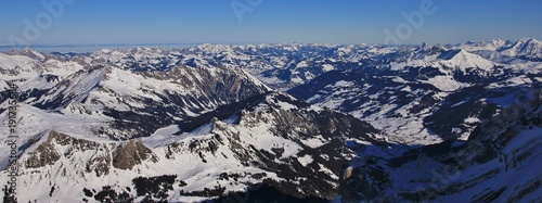 Saanenland valley on a winter morning. view from Glacier des Diablerets, Switzerland.