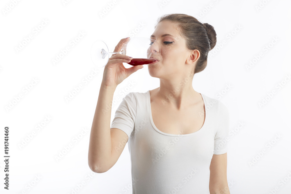 young woman hold and drink a glass of red wine young woman hold and drink a glass of red wine