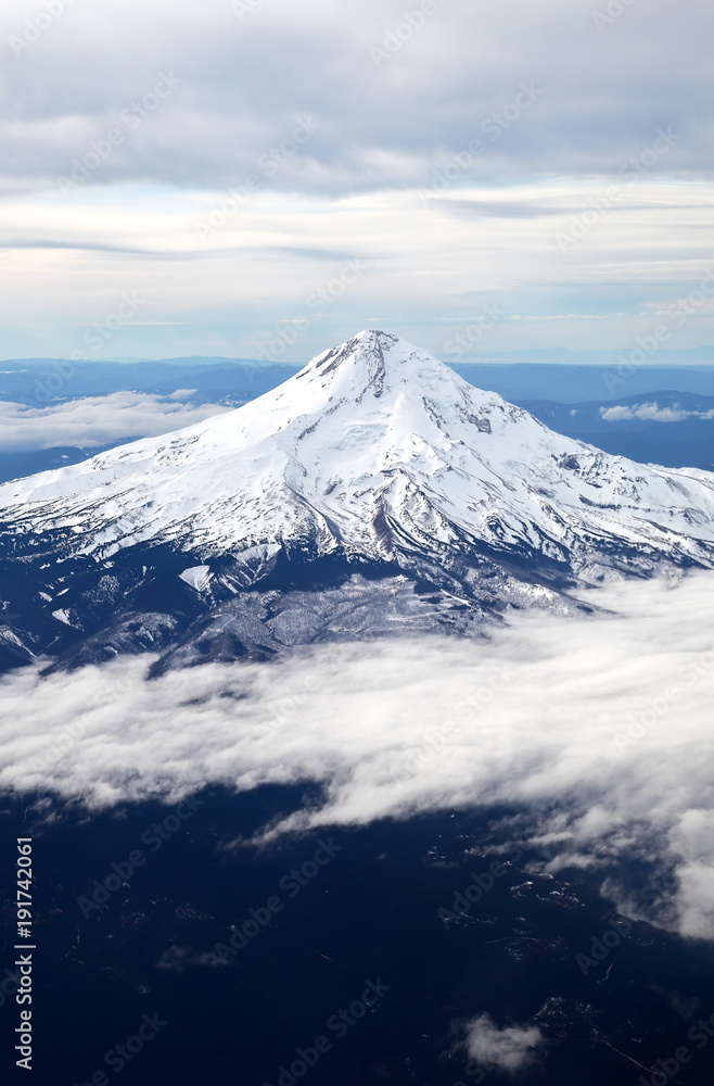 
    Snow-capped mountain peak from the air. 