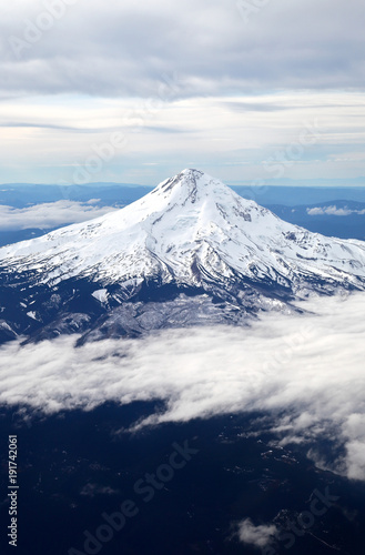       Snow-capped mountain peak from the air.  © diak