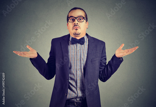 Elegant young man looking ignorant