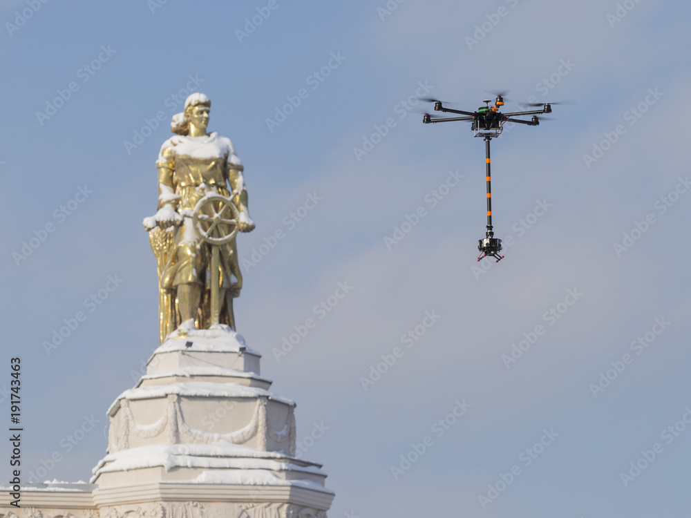 Unrecognizable drone hexakopter in flight