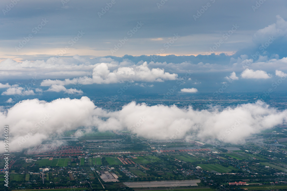 view from airplane to land with cloud