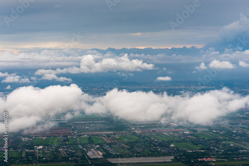 view from airplane to land with cloud