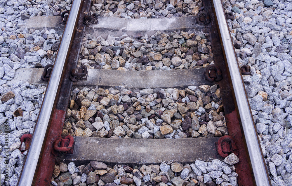 railroad tracks made of steel rails along which passenger and freight