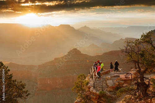 Sunrise at Grand Canyon. Photo Shows a Group of Tourists Watching Sunrise at Mather Point which is famous for Sunrise. © jayyuan