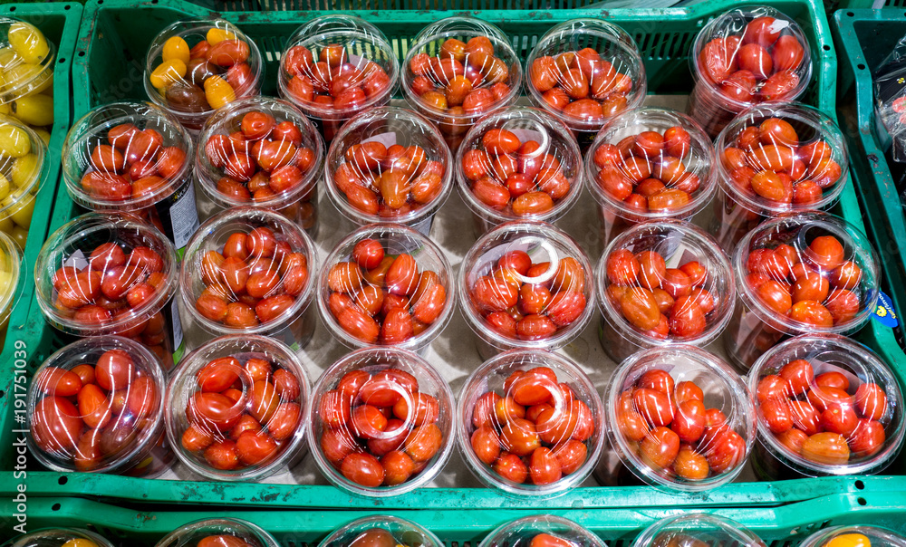 Fototapeta premium Cherry tomatoes in plastic. view from above
