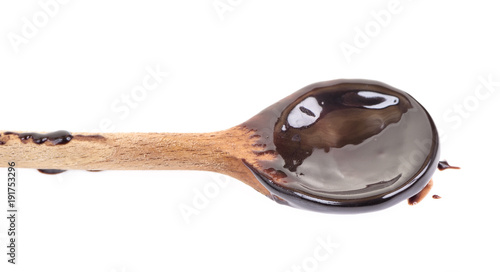 Chocolate on wooden spoon isolated on white background. 