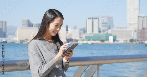 Photography Woman using cellphone in Hong Kong