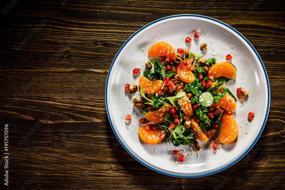 Vegetable salad on wooden background Vegetable salad on wooden background