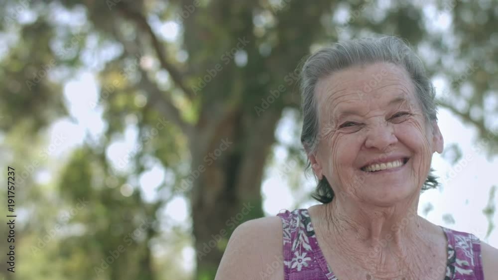 Smiling elderly woman looking at camera Smiling elderly woman looking at camera
