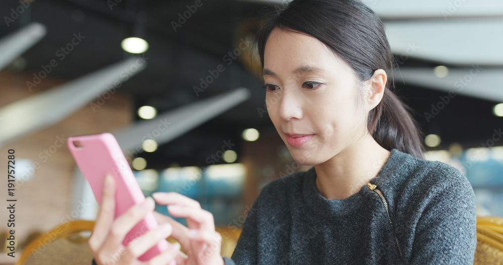 Woman use of mobile phone in coffee shop Woman use of mobile phone in coffee shop
