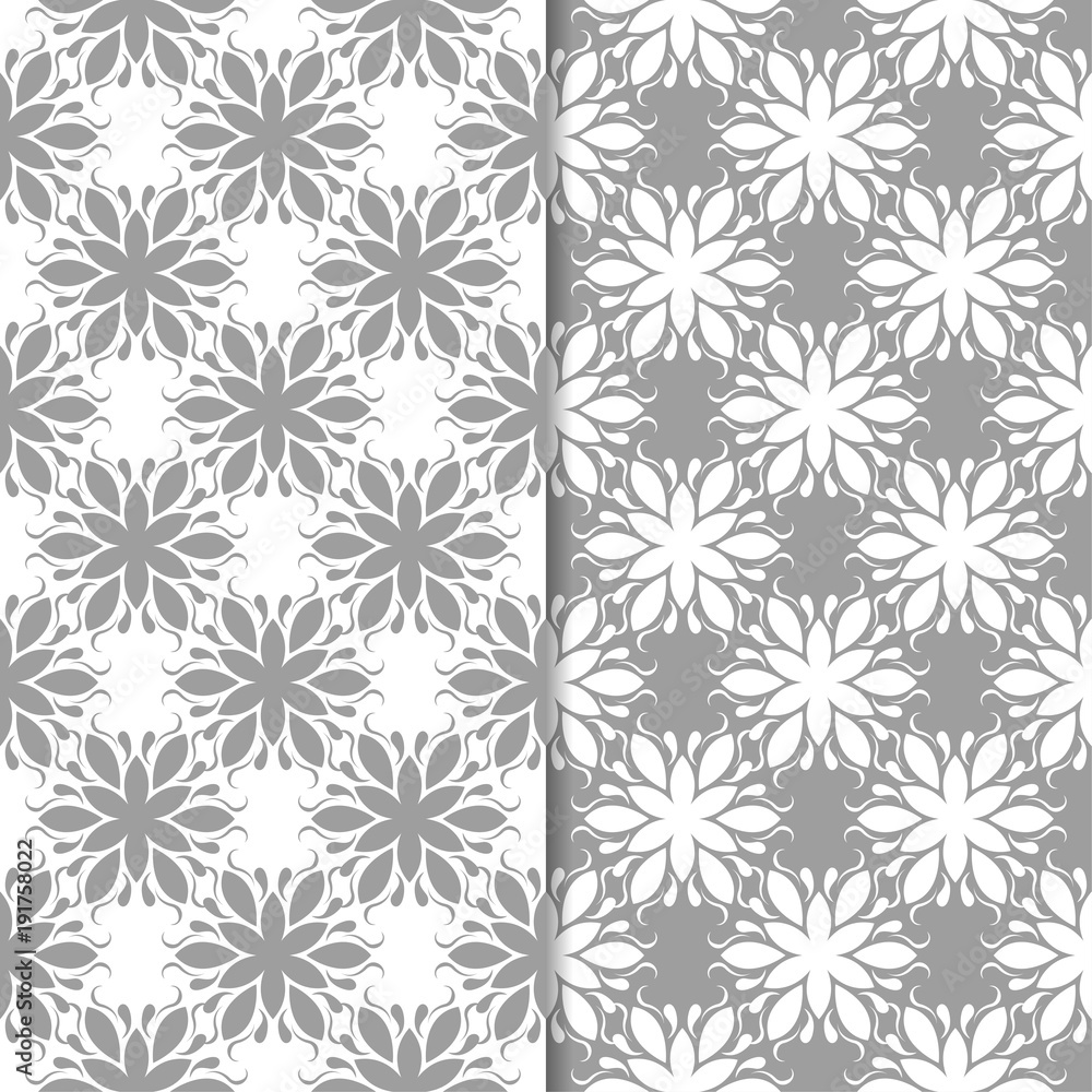 White and gray floral backgrounds. Set of seamless patterns White and gray floral backgrounds. Set of seamless patterns