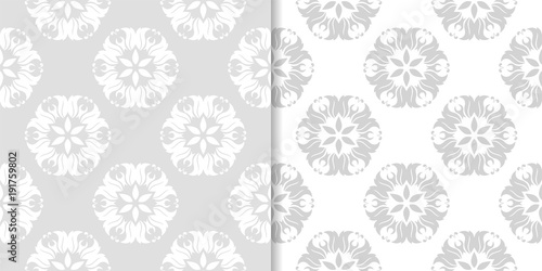 Light gray floral ornamental designs. Set of seamless patterns