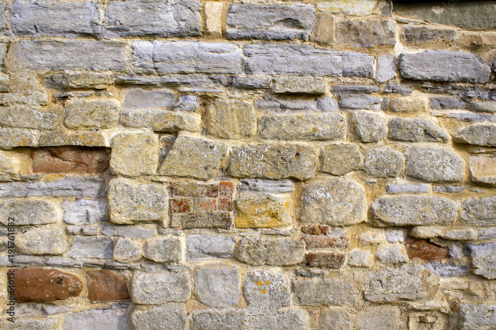 Stone and brick texture on an old worn and repaired wall, Tewkesbury, Gloucestershire, Severn Vale, UK Stone and brick texture on an old worn and repaired wall, Tewkesbury, Gloucestershire, Severn Vale, UK