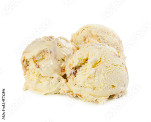 Three balls of vanilla ice cream with caramel