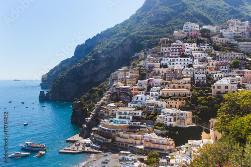 Εκτύπωση καμβά Positano Italy landscape blue sea background, colorful flowers, cloudy sky littl