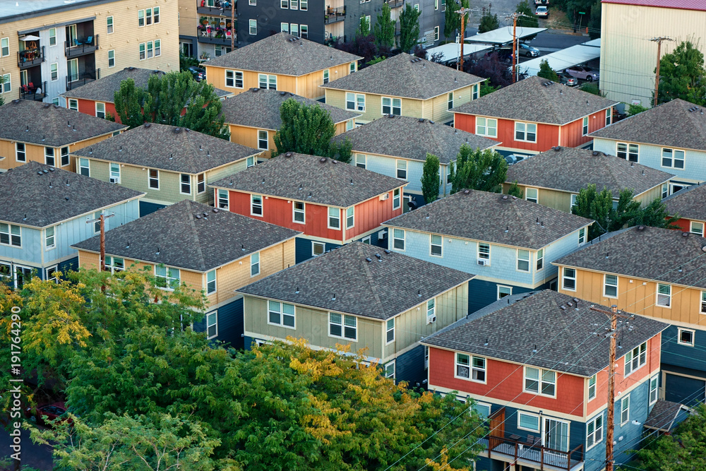 Looking down at a block of a row of similar houses.