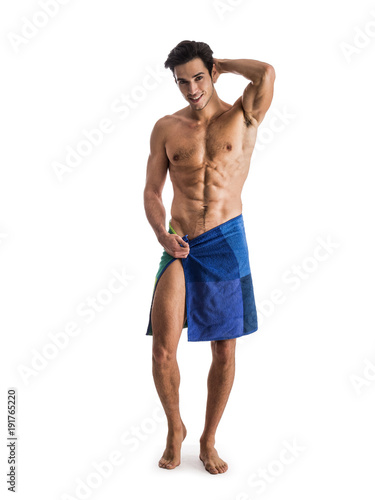 Bild auf Leinwand Portrait of naked handsome young man with languishing look covering crotch with