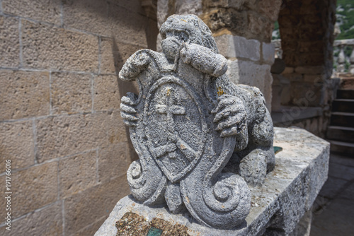 Small stone sculpture next to museum on the isle of Our Lady of Rocks in Kotor Bay, Montenegro