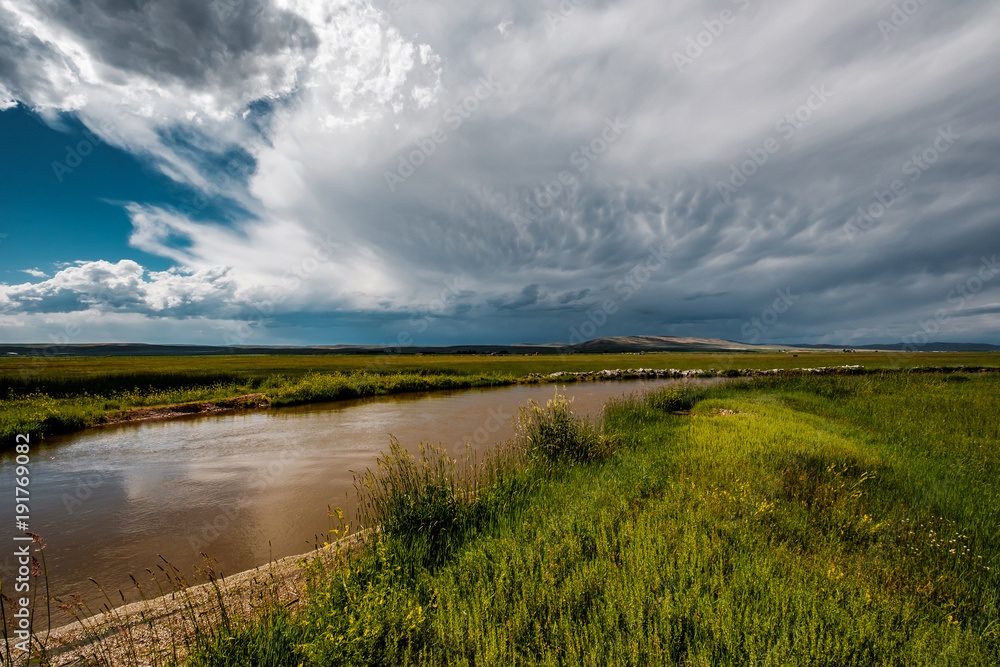 Stormy clouds above river in Wyoming