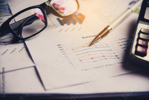 Document Book Pen Graph Calculator And accounting documents placed on the desk in office