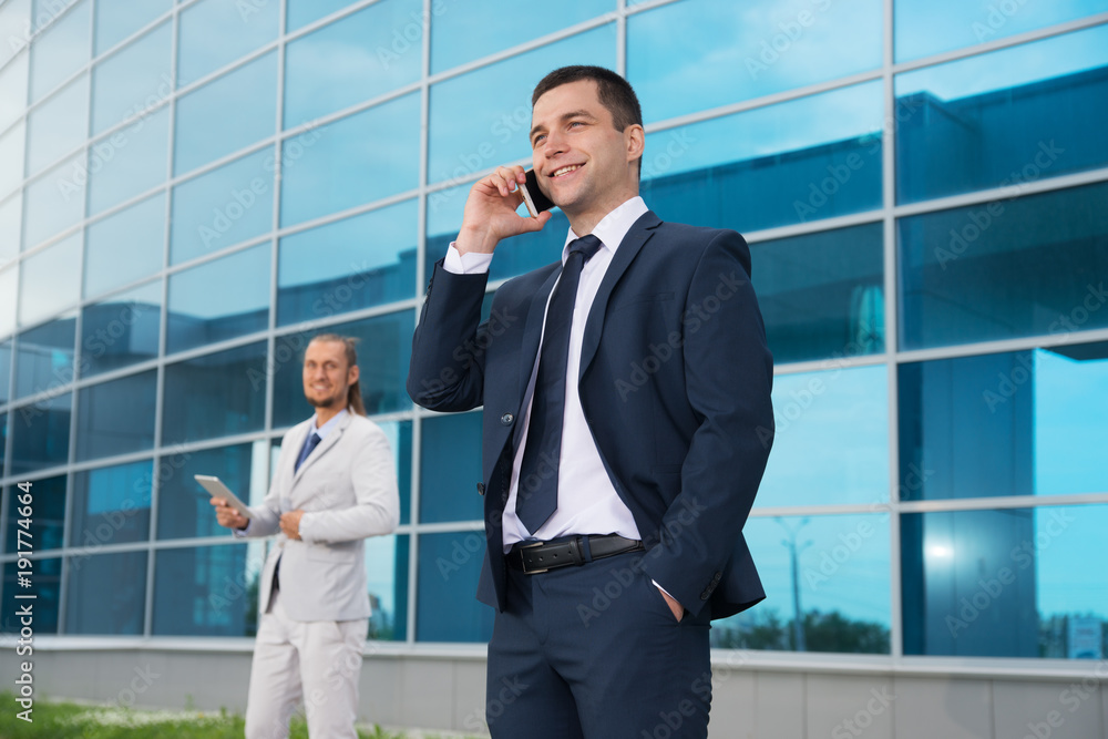 a businessman in a suit around the office a businessman in a suit around the office