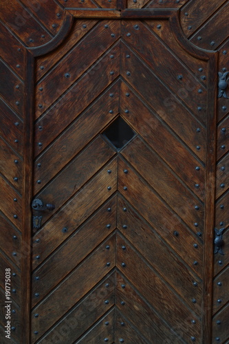 Wooden door in some Prague church, Czech. Exterior.