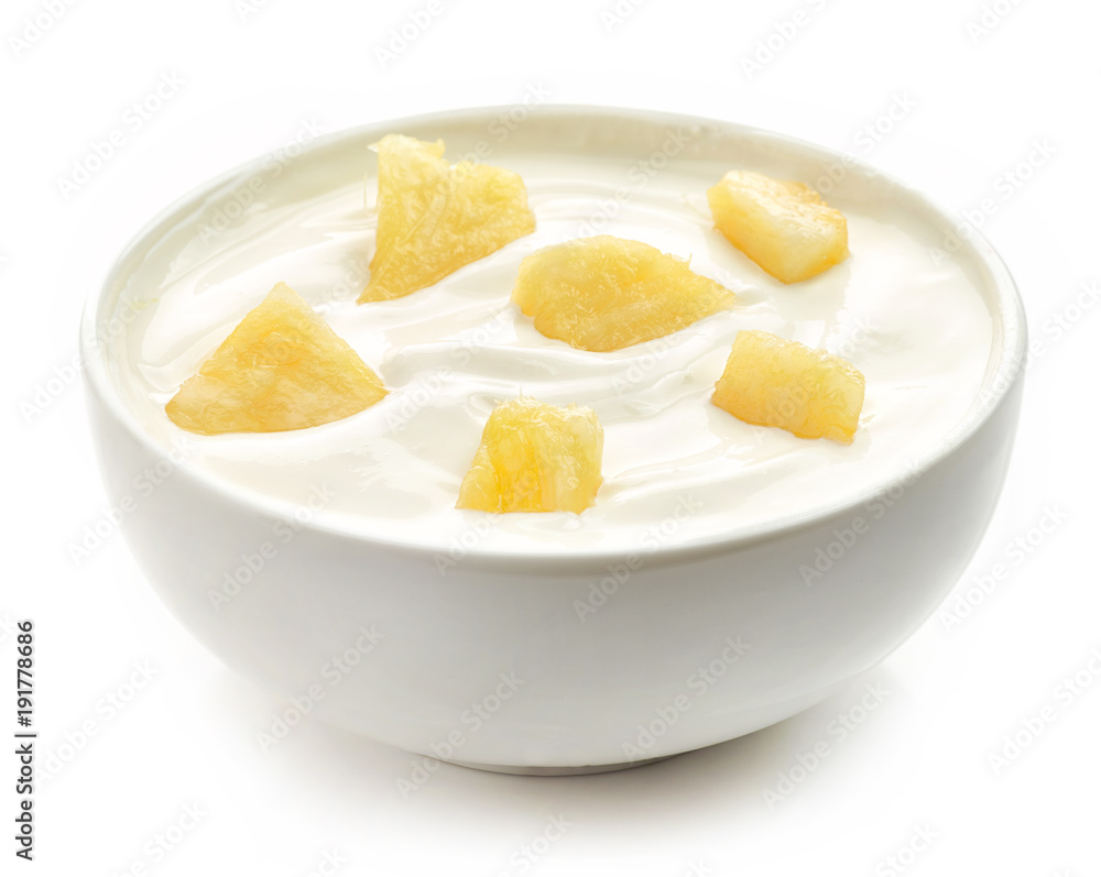 bowl of yogurt with pineapple pieces bowl of yogurt with pineapple pieces