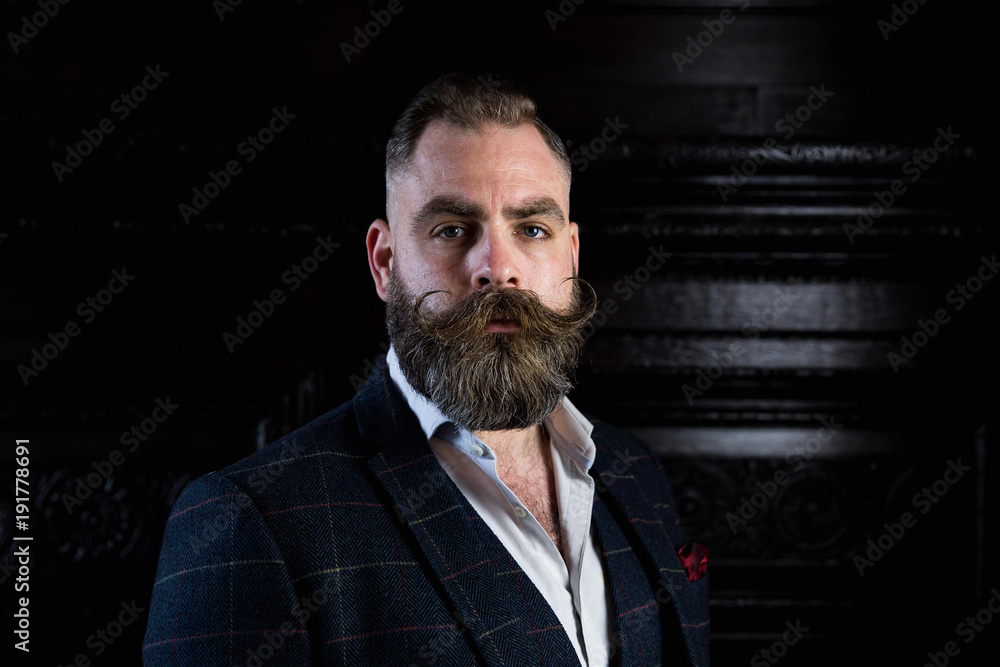 Smart man with a beard and moustache wearing a suit Smart man with a beard and moustache wearing a suit