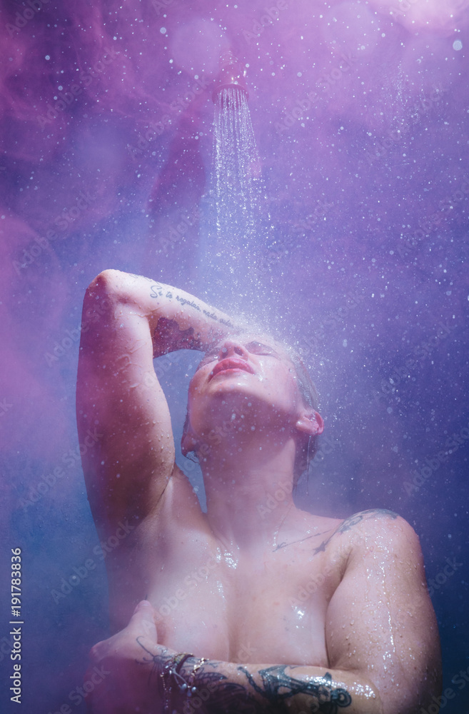 Fototapeta premium woman in shower with colorful steam