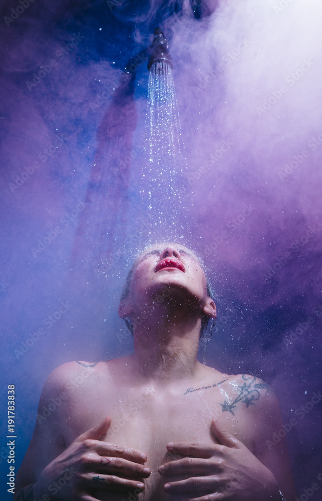 Obraz premium woman in shower with colorful steam