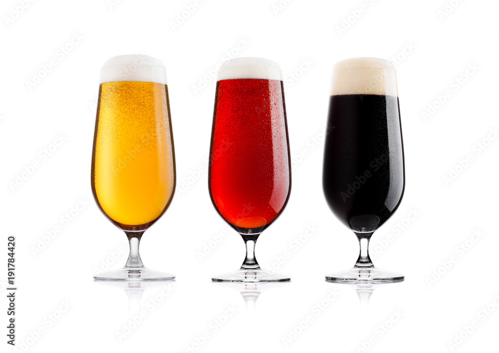 Cold glasses of lager stout and red beer with dew Cold glasses of lager stout and red beer with dew