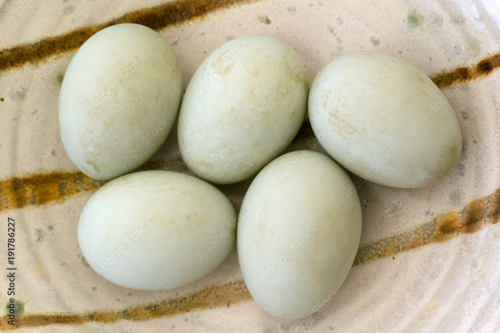 Five fresh free range duck eggs in a bowl. Shallow depth of field. Five fresh free range duck eggs in a bowl. Shallow depth of field.