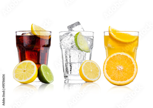 Glasses of cola and orange soda drink and lemonade