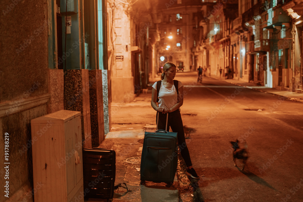 night scene on an orange lit street in the middle of the night in the cuban city Havana, all shot in a lovely atmosphere, lit by the street lights night scene on an orange lit street in the middle of the night in the cuban city Havana, all shot in a lovely atmosphere, lit by the street lights